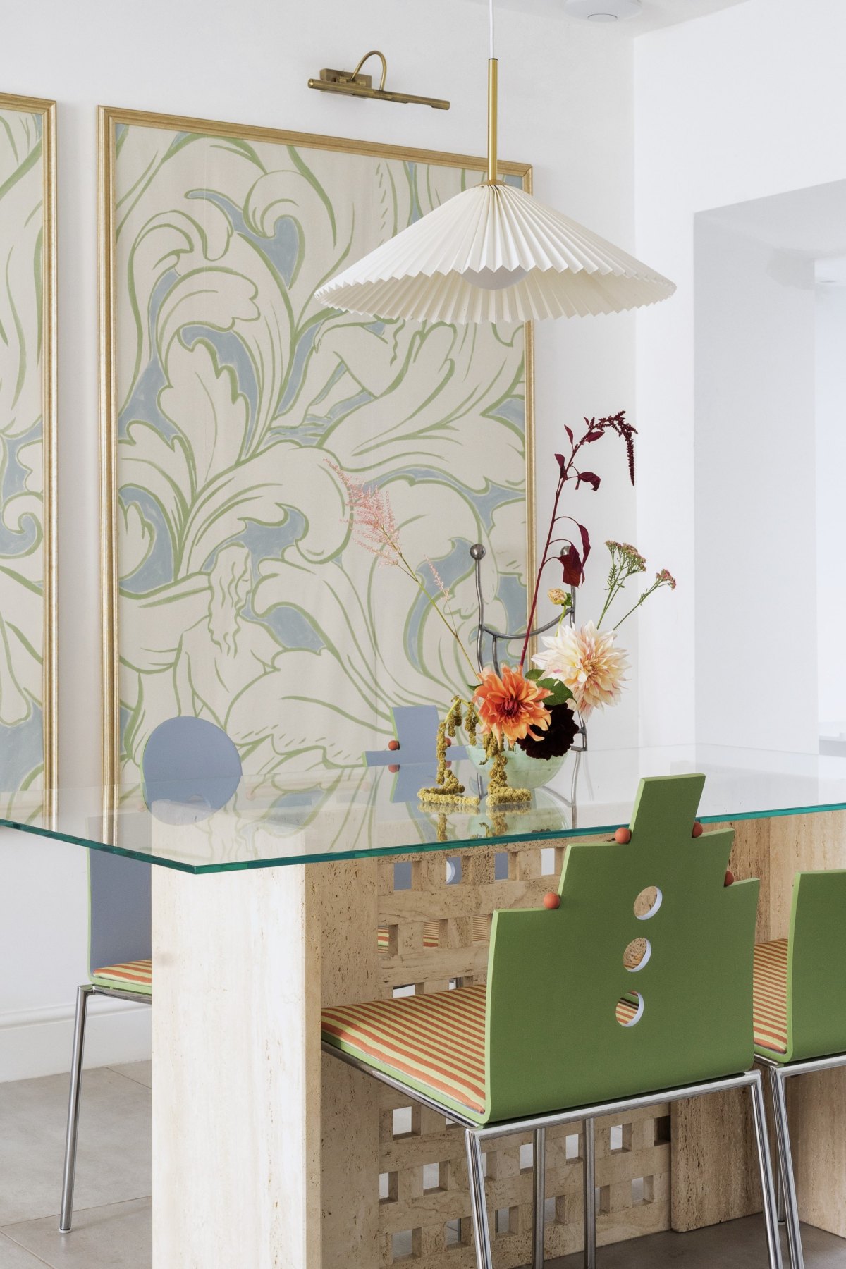 Sculptural Bentwood Chairs, Ikebana flowers, Brutalist travertine table, pleated pendant lamp