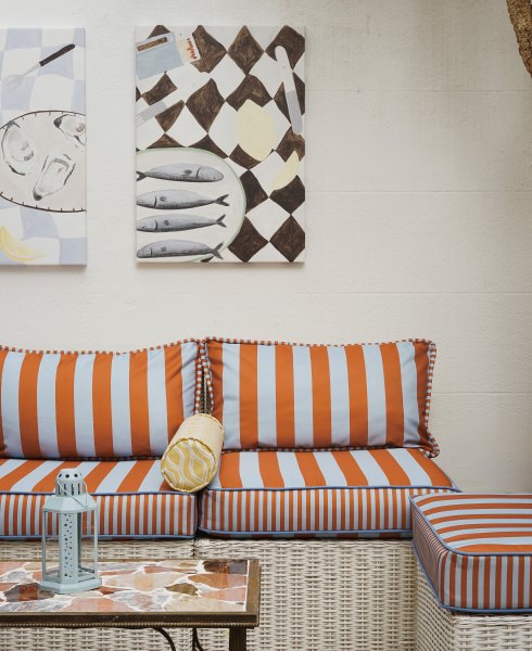 desenio outdoor wall art, awning stripe outdoor sofa, bolster cushion, marble pave table